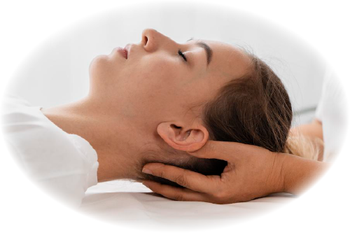 Woman's head being cradled by two hands on a professional massage table